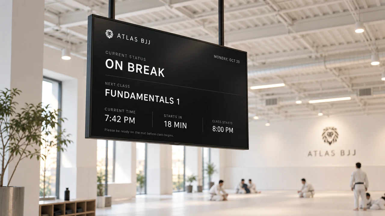 A large screen on the wall of an academy showing the class timetable